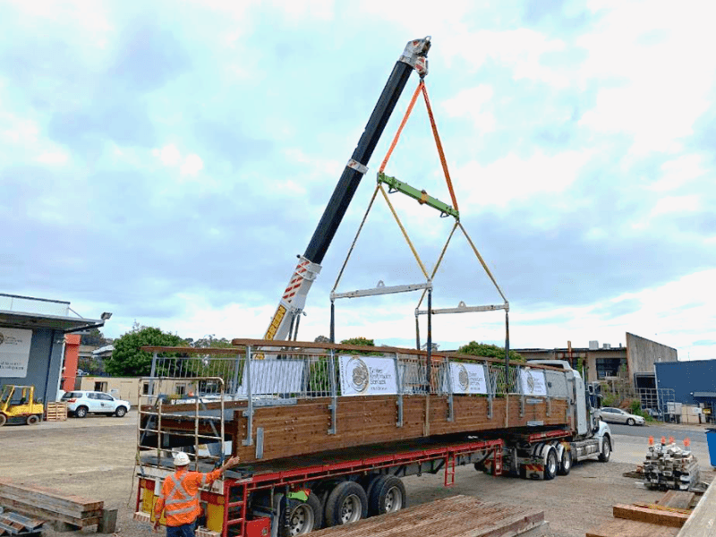 TRS Loading fully assembled and treated Pedestrian Timber bridge for transport to be installed.