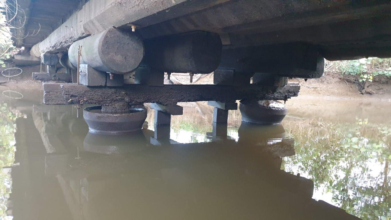 under side of the original River Road Structure show piles and bents. 