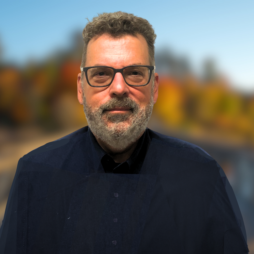 pictured: David Allen the General manager of Timber Restoration Services Canada on a wooded background that is blurred for a professional headshot