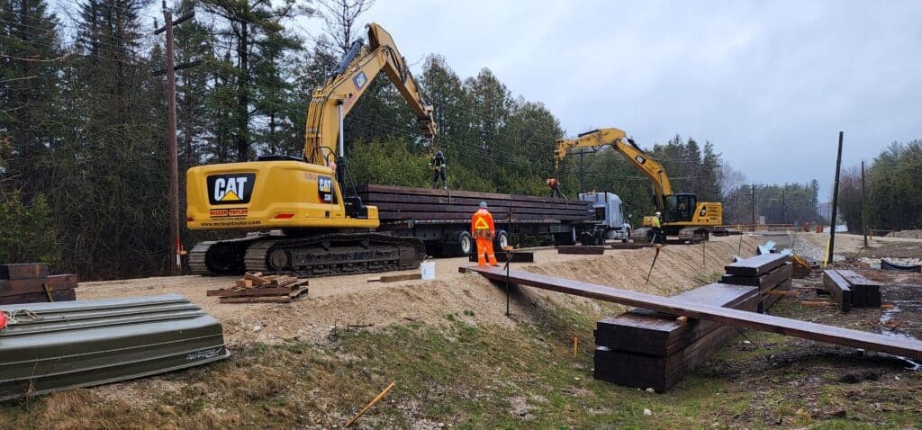 Crane positioning mass timber at the Lantz Bridge