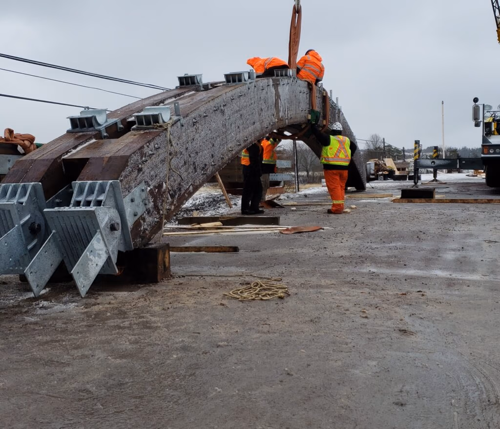 TRS crew installing a glulam arch at Roger Bacon Bridge