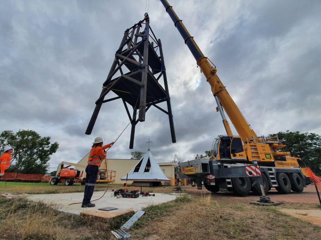 Crane hoisting the St. Columba Belltower into position